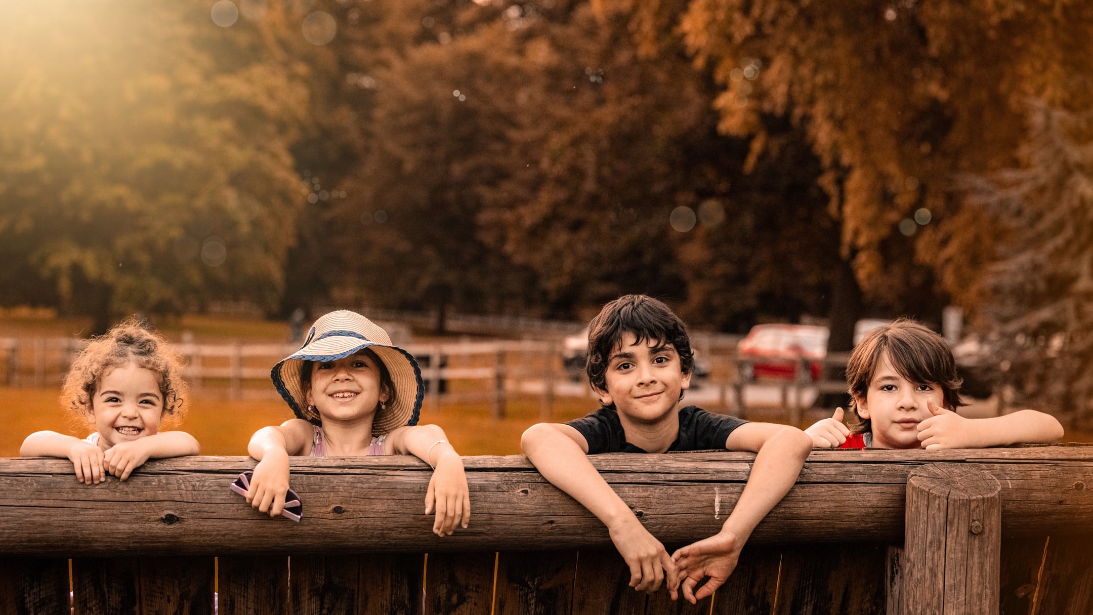 Children playing outdoors at golden hour