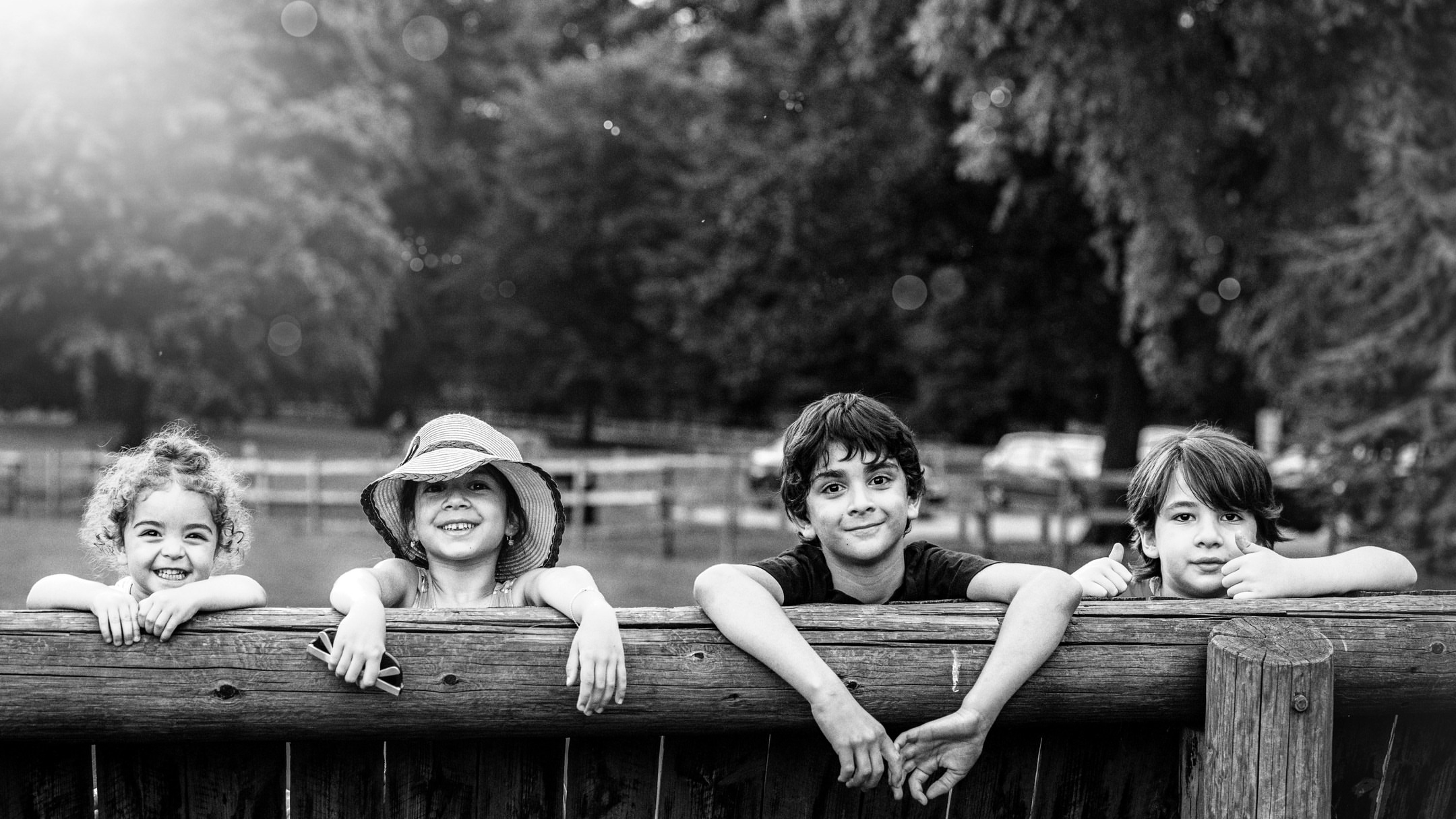 Children outside in black and white