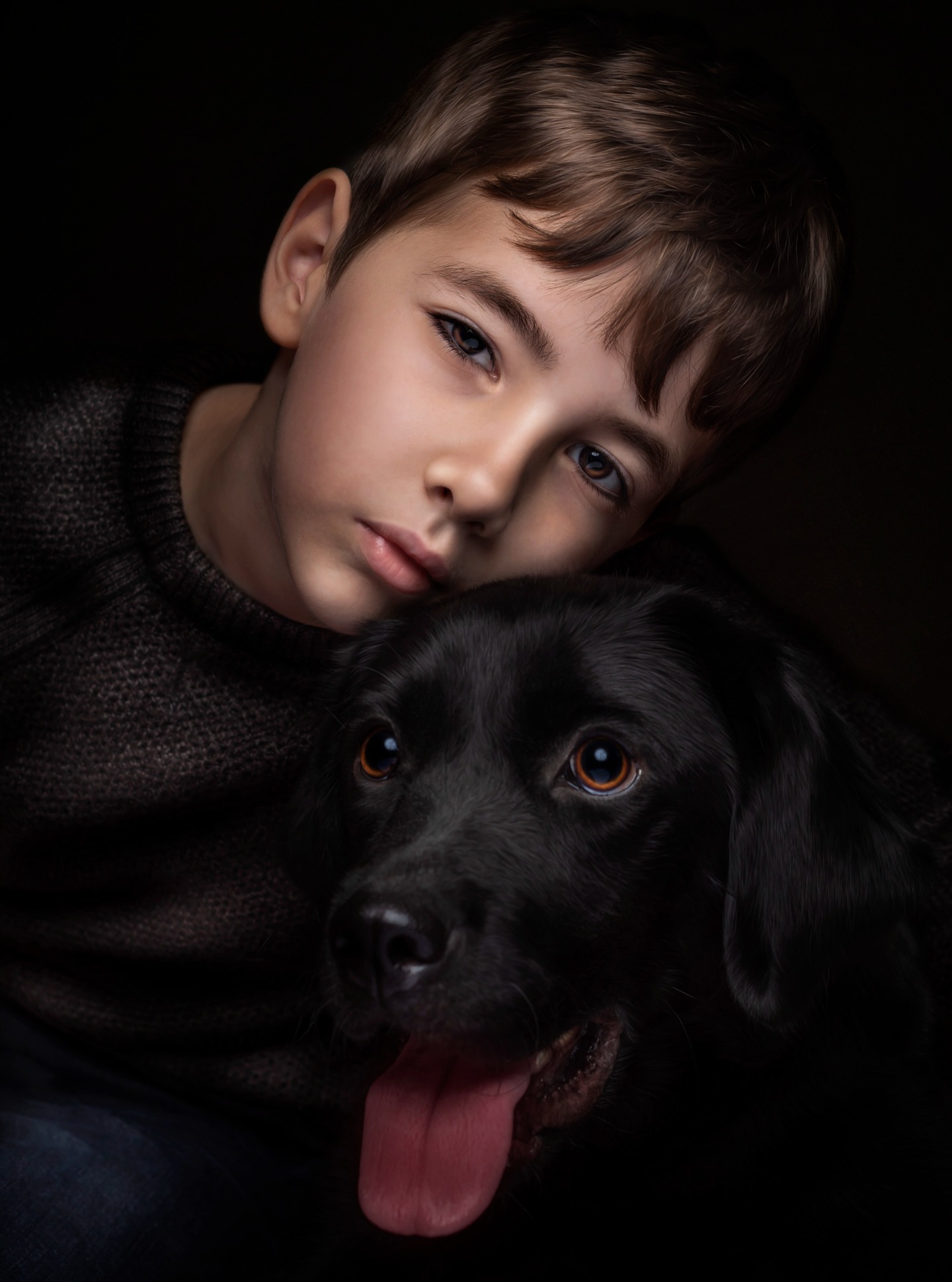 Fine art portrait of a boy with dramatic light