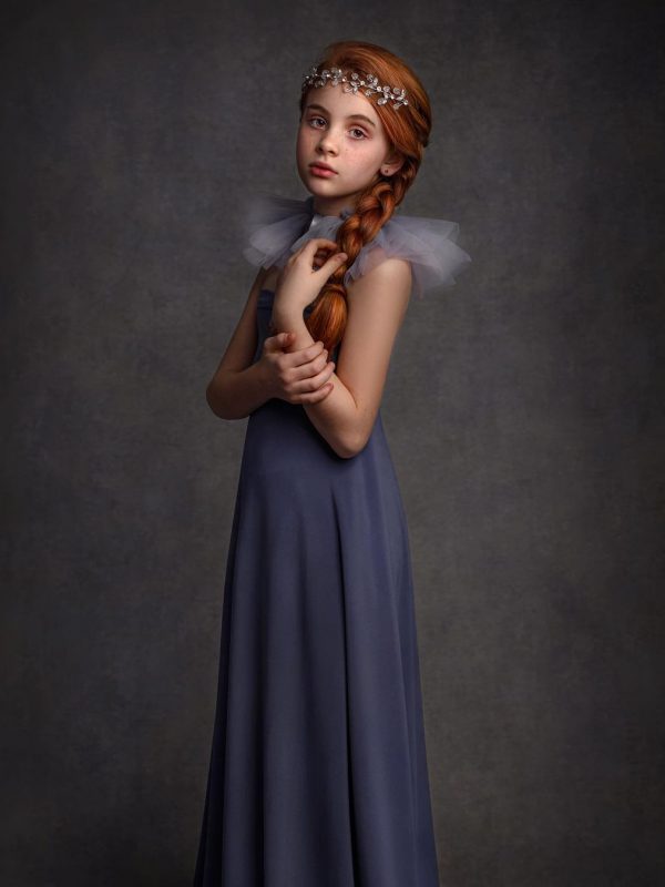 Fine art portrait of a girl in dramatic light